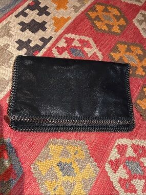 Stella McCartney Falabella shaggy deer clutch 
NWOT